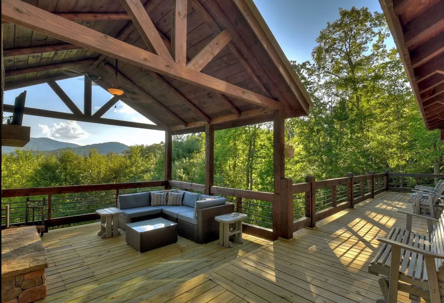 Covered mountain patio at Chalet Blue Ridge with seating after annual fall festivals near Blue Ridge