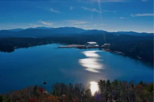 Aerial view of a mountain lake near where to stay in Blue Ridge, GA with forested shoreline