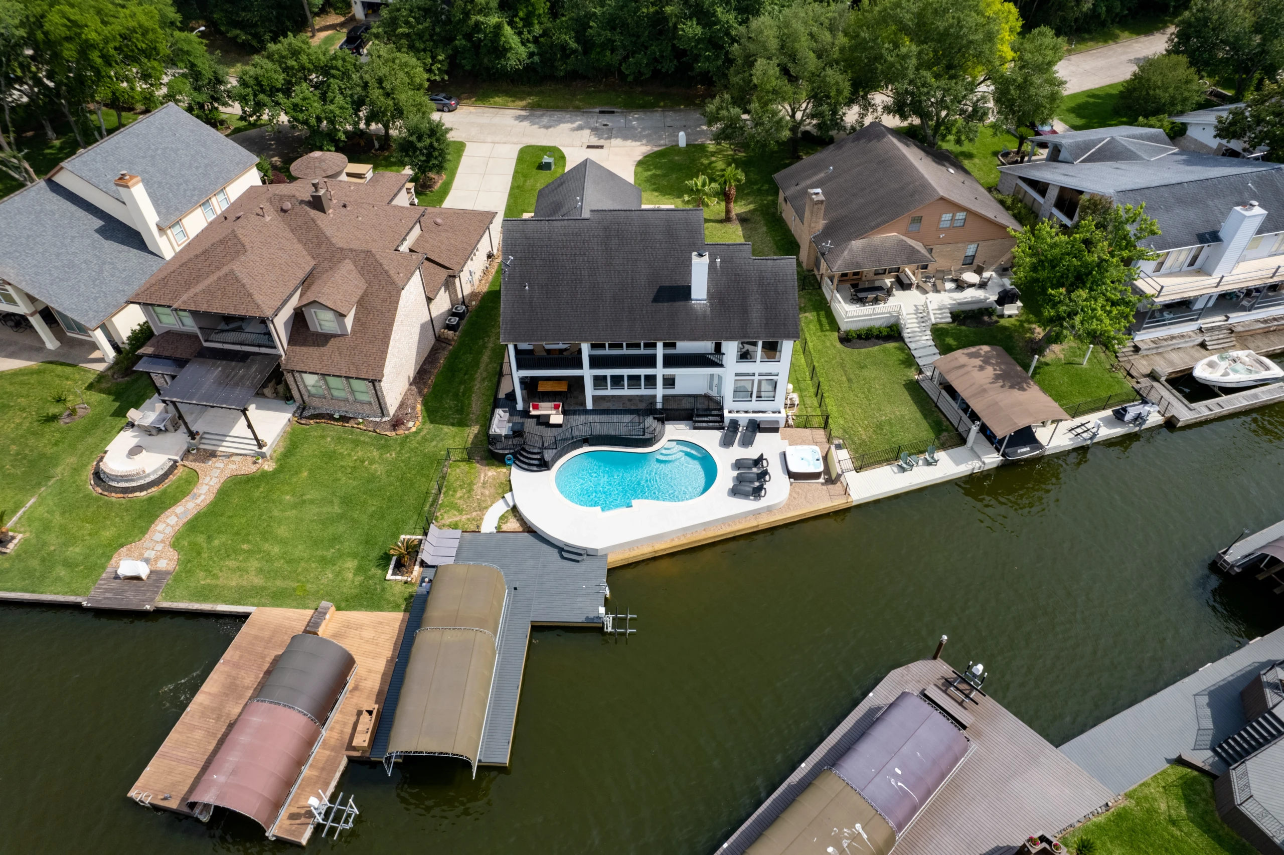 The Waterfront Villa aerial view with pool and dock, where to stay in Montgomery, TX