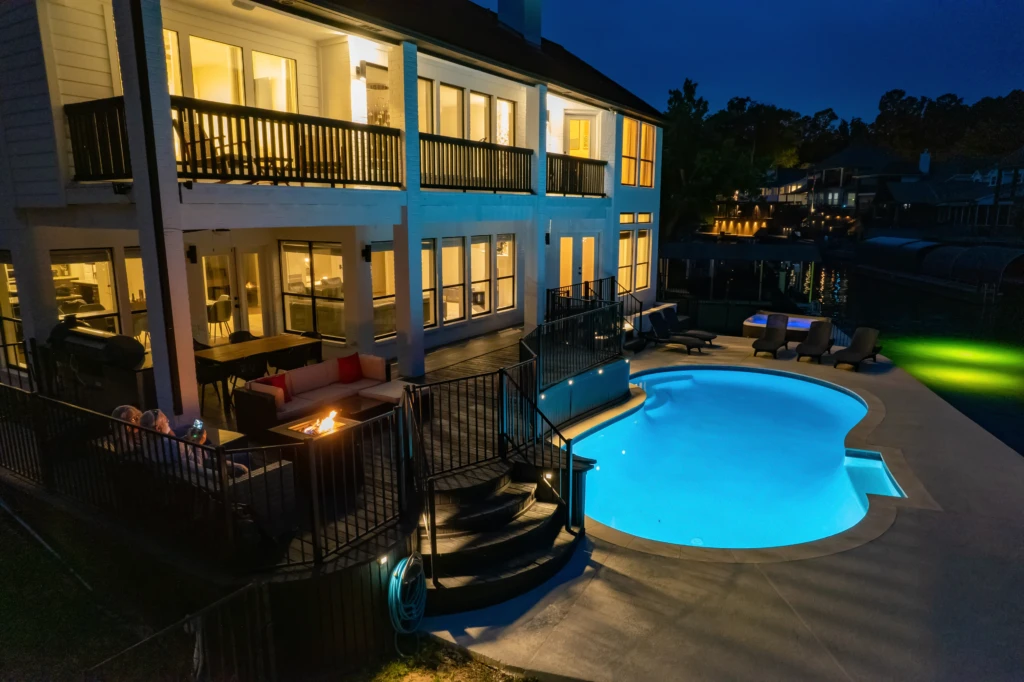 Luxurious waterfront pool with turquoise saltwater design, deck, and private boat dock where to stay in Montgomery