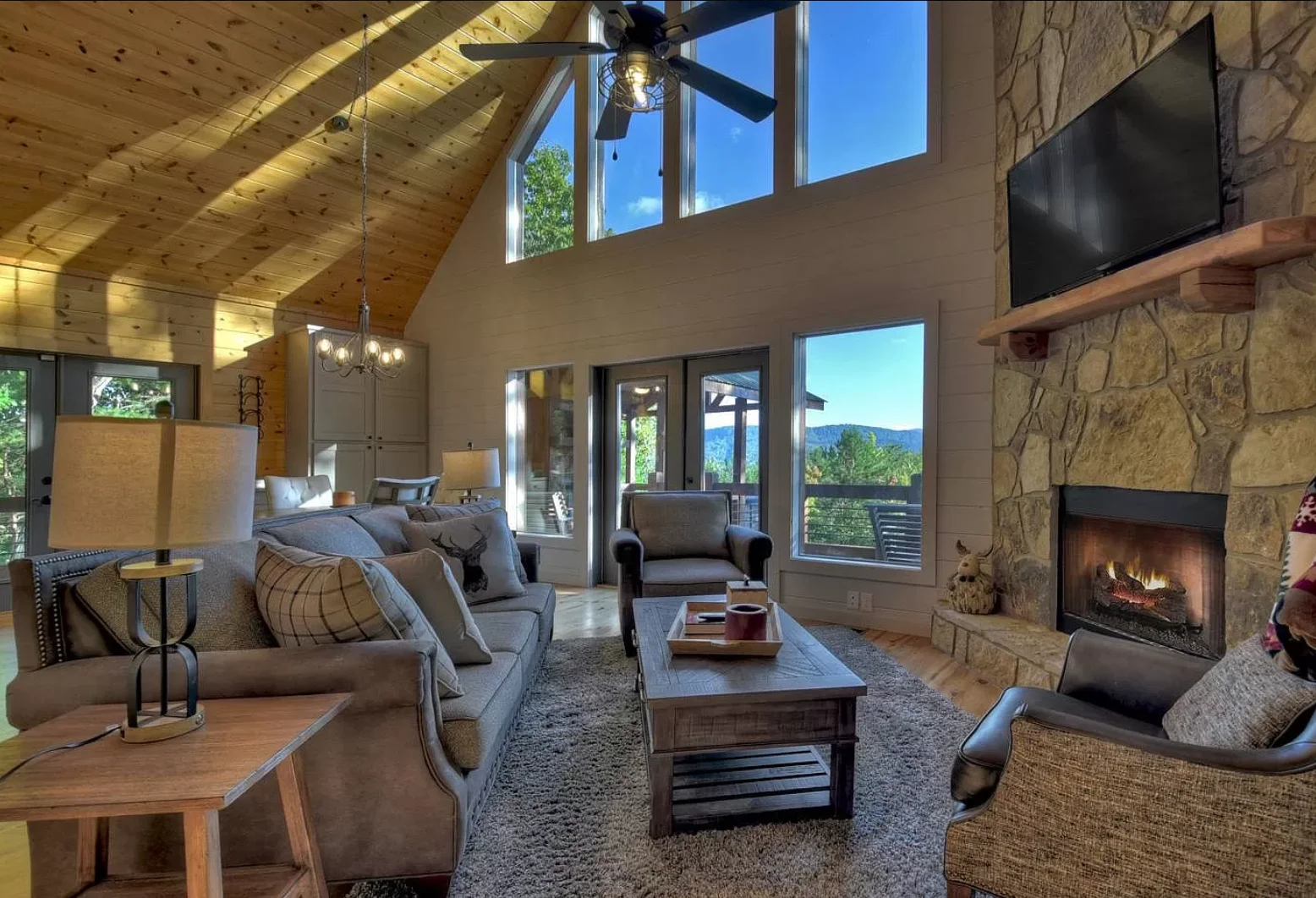 Stone fireplace living room at Chalet Blue Ridge, a home base for a festival group getaway