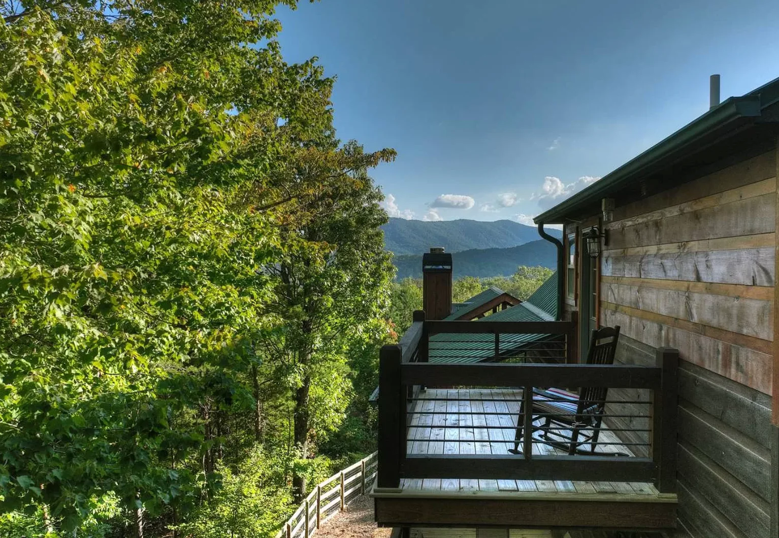 Mountain chalet deck with lake and Blue Ridge mountain views near Blue Ridge golf courses