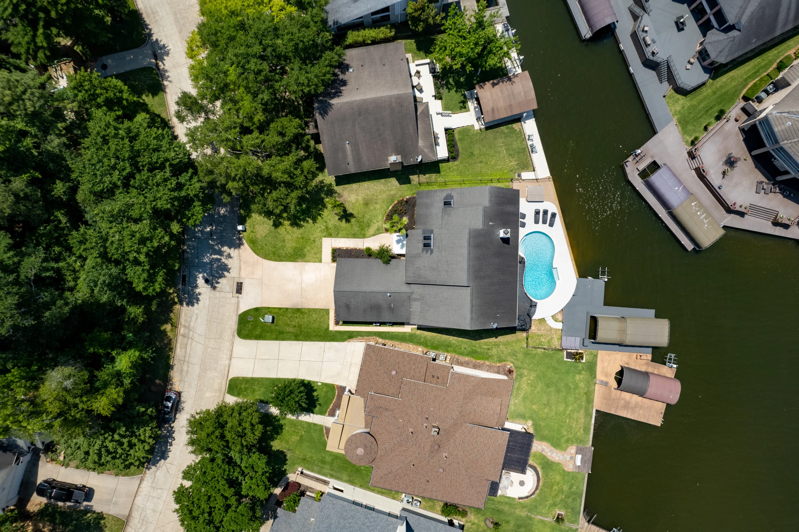 Aerial view of a villa with pool and lawn, a home base for a weekend getaway Panama City Beach