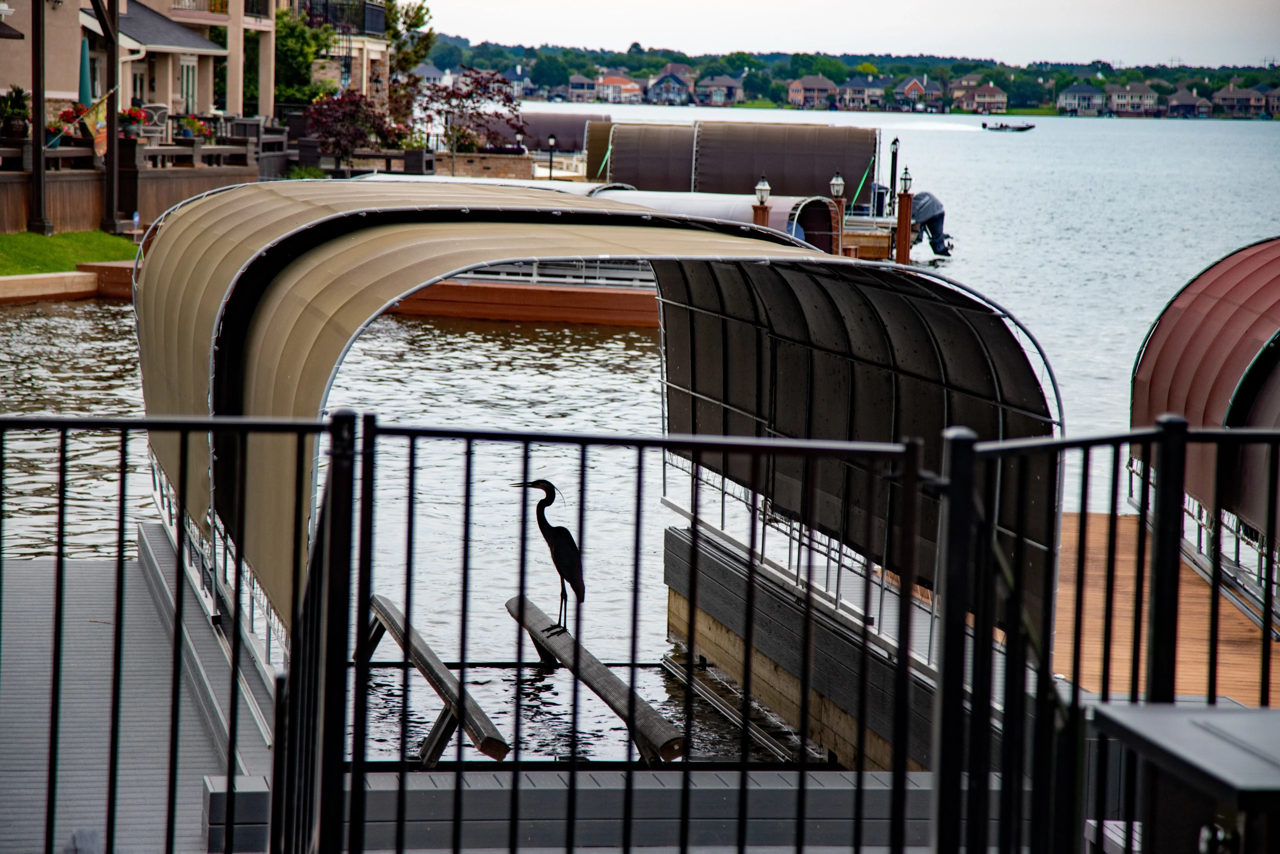 Private dock and boats at The Waterfront Villa on Lake Conroe, a Nest Awaits home for large groups