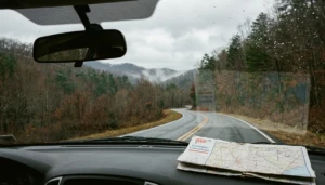 Mountain road through forested North Georgia hills, a scene for deciding which is better, Blue Ridge or Helen, GA